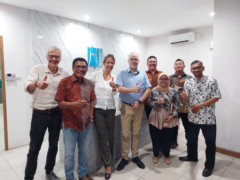 eight people happy in indonesian office of John Cockerill Hamon